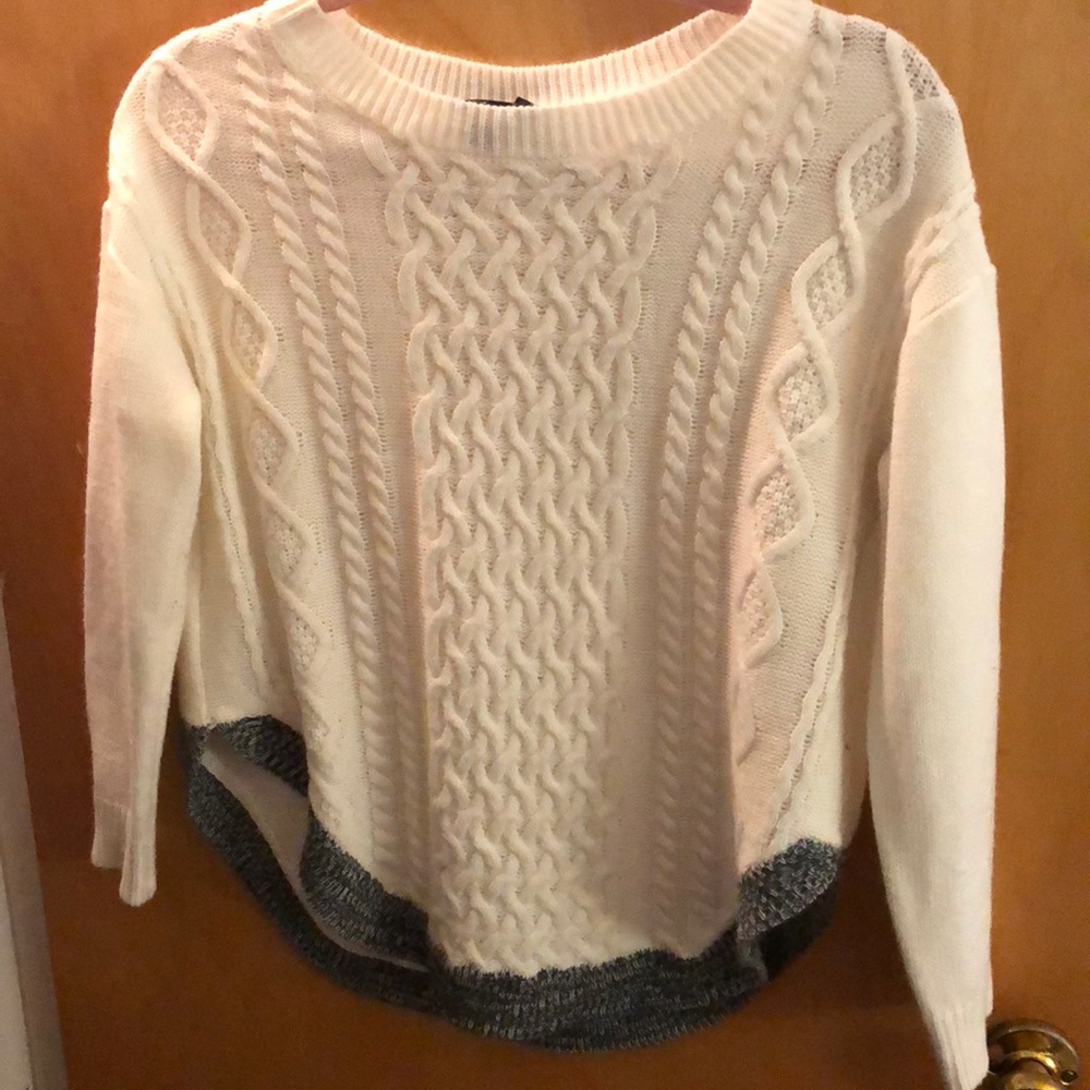 White sweater with grey trim